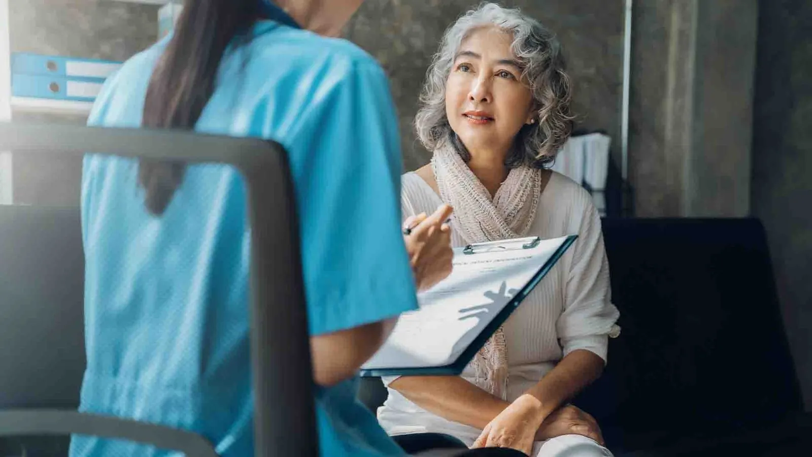Clinician with senior patient