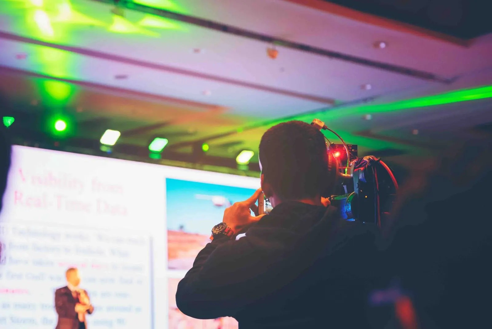 Videographer filming conference
